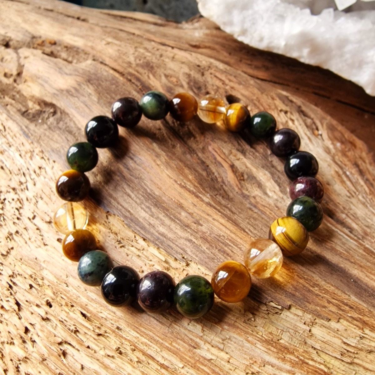 High-vibrational healing bracelet made with natural crystal beads of Citrine, tiger eye, jade, garnet, and obsidian