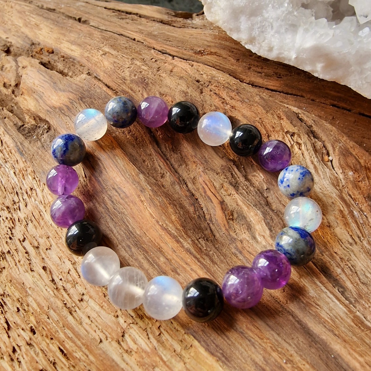 High-vibrational crystal bead bracelet made with labradorite, lapis lazuli, amethyst, moonstone, and obsidian.