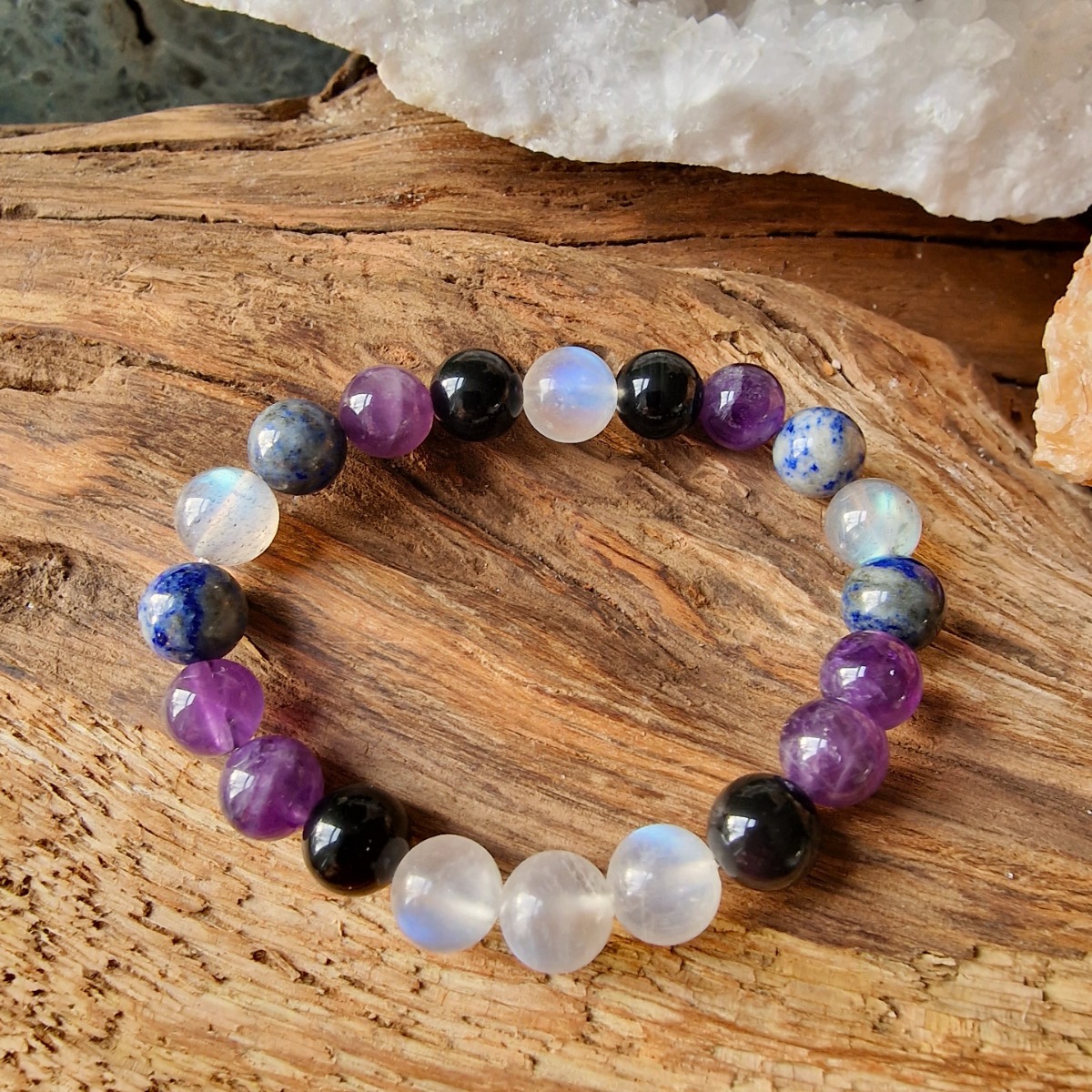 Transformational healing crystal bracelet made with natural crystal beads of Amethyst, Labradorite, Lapis Lazuli, Moonstone, and Obsidian.