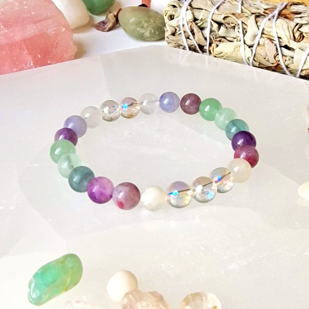 Aventurine, Pink Tourmaline, Fluorite, Moonstone, and Aura Quartz crystal bracelet made with natural high-quality 8mm crystal beads and stretch cord. 