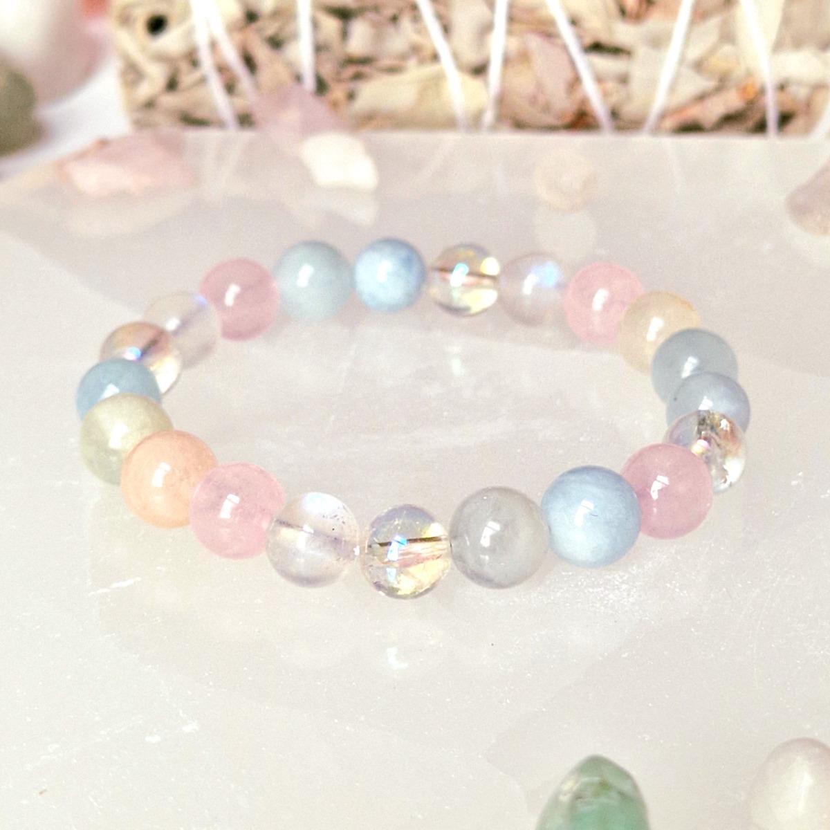Pure Crystal's Abundance crystal bracelet will help you heal your heart, embrace joy, and manifest whatever your heart desires. The bracelet is made with high-quality crystal beads of Aquamarine, Aura Quartz, Morganite, Rose quartz and Moonstone